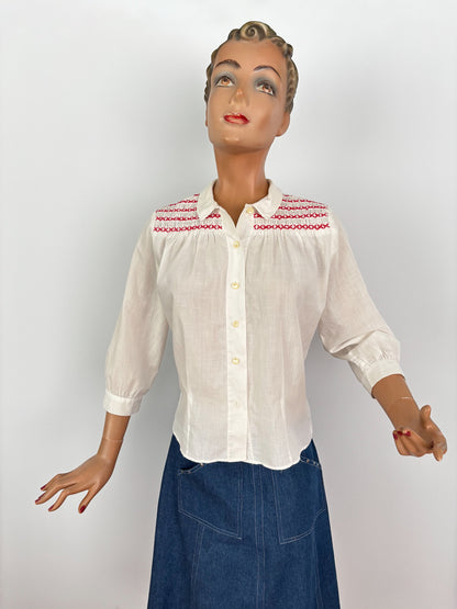 1950s White Cotton Batiste Blouse With Red Smocked Shoulder Detail | S
