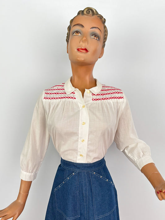 1950s White Cotton Batiste Blouse With Red Smocked Shoulder Detail | S