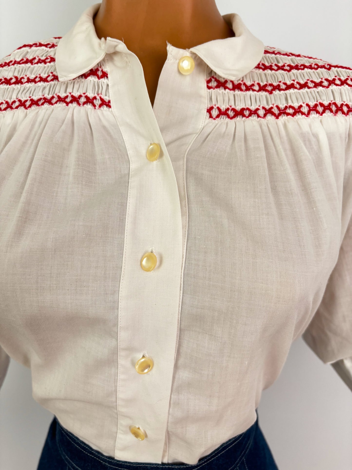 1950s White Cotton Batiste Blouse With Red Smocked Shoulder Detail | S