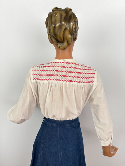 1950s White Cotton Batiste Blouse With Red Smocked Shoulder Detail | S
