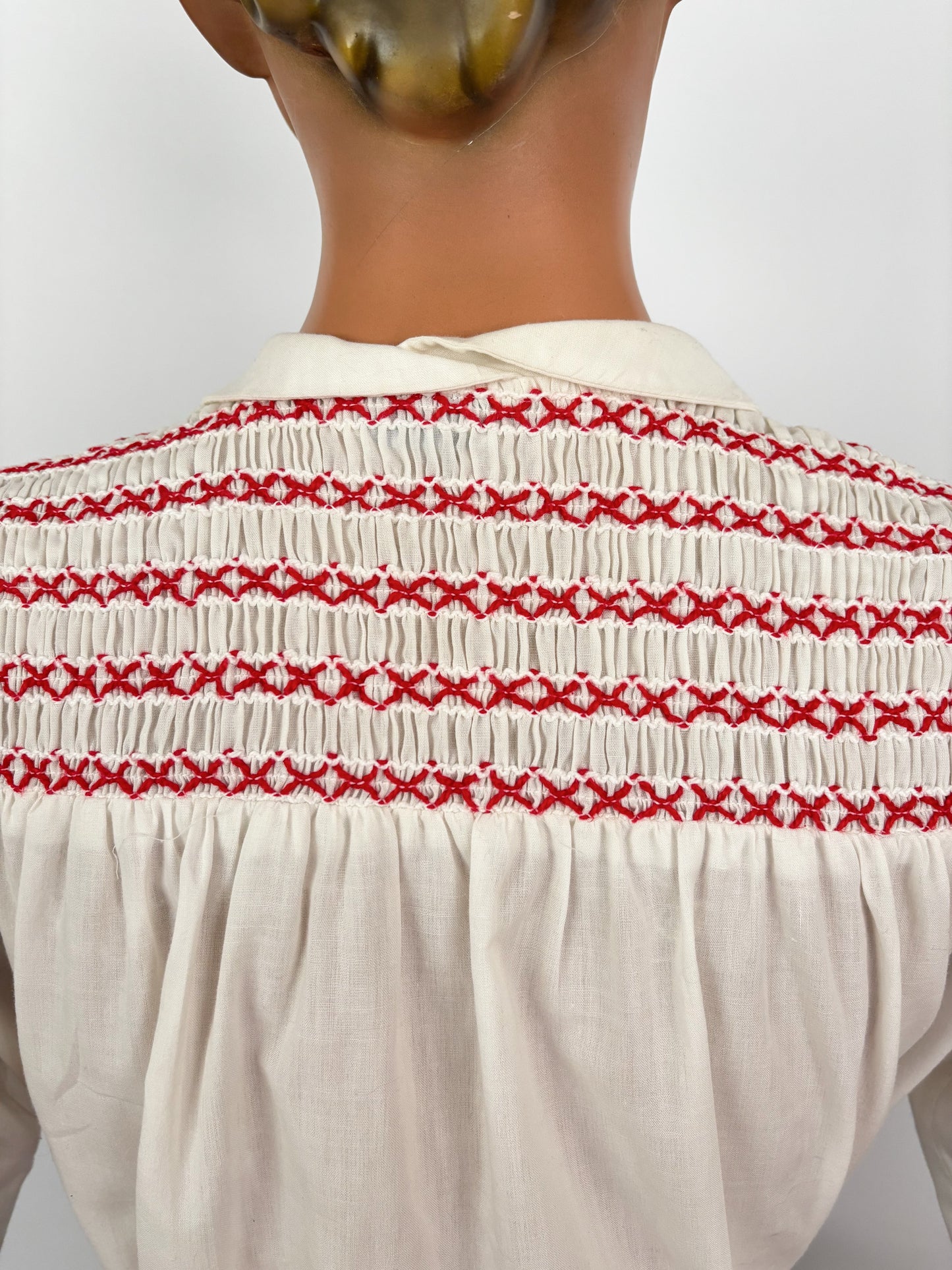 1950s White Cotton Batiste Blouse With Red Smocked Shoulder Detail | S