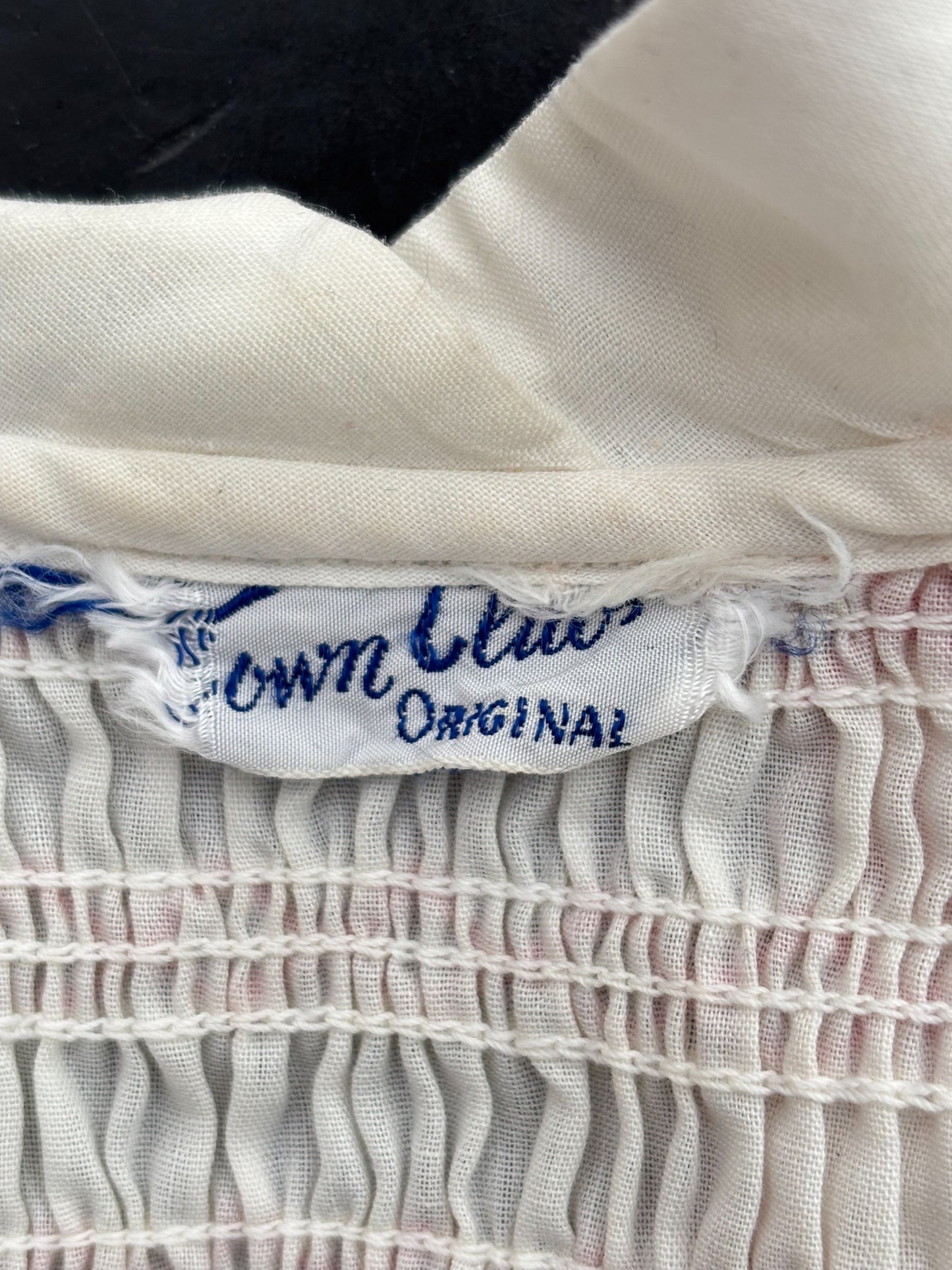 1950s White Cotton Batiste Blouse With Red Smocked Shoulder Detail | S